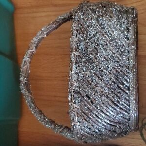 Cute sparkly basket approx 8 inches x 4 inches wide.  Did not formally measure